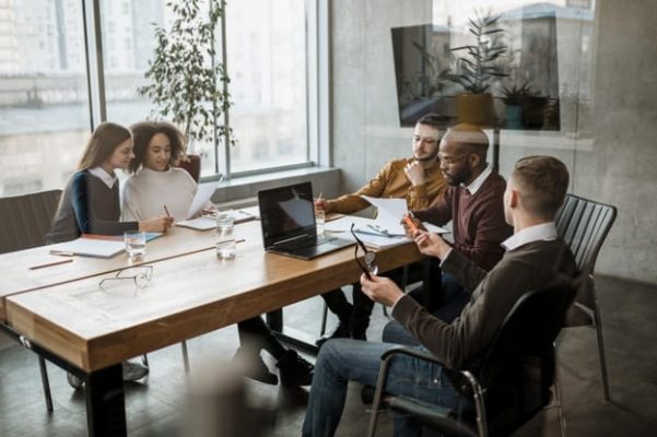 front-view-people-having-meeting-office_23-2148817053